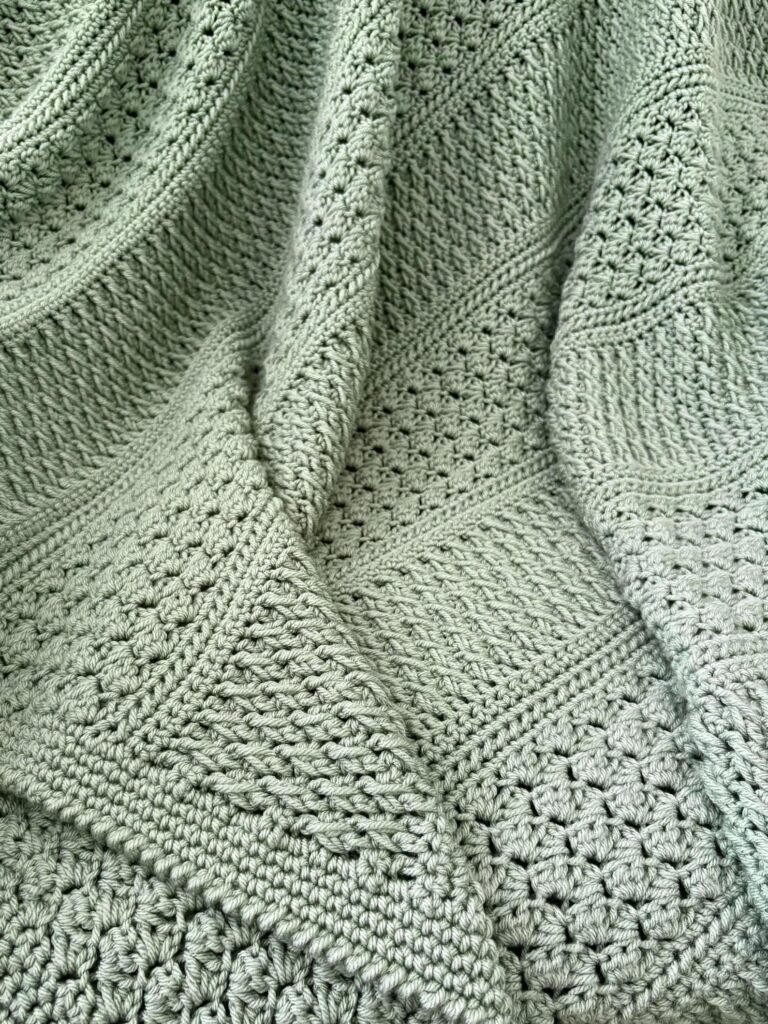 Textured crochet throw pattern featuring Alpine and Sedge stitches in solid color